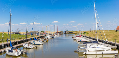 Panorama of sailing yachts in the harbor of Termunterzijl, Netherlands photo
