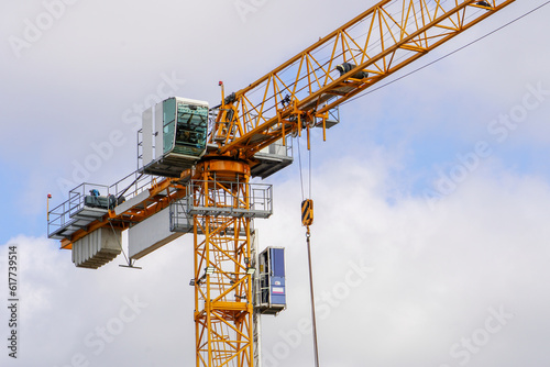 Wallpaper Mural Building under construction. Crane machinery structure. Industry. Vertical
 Torontodigital.ca