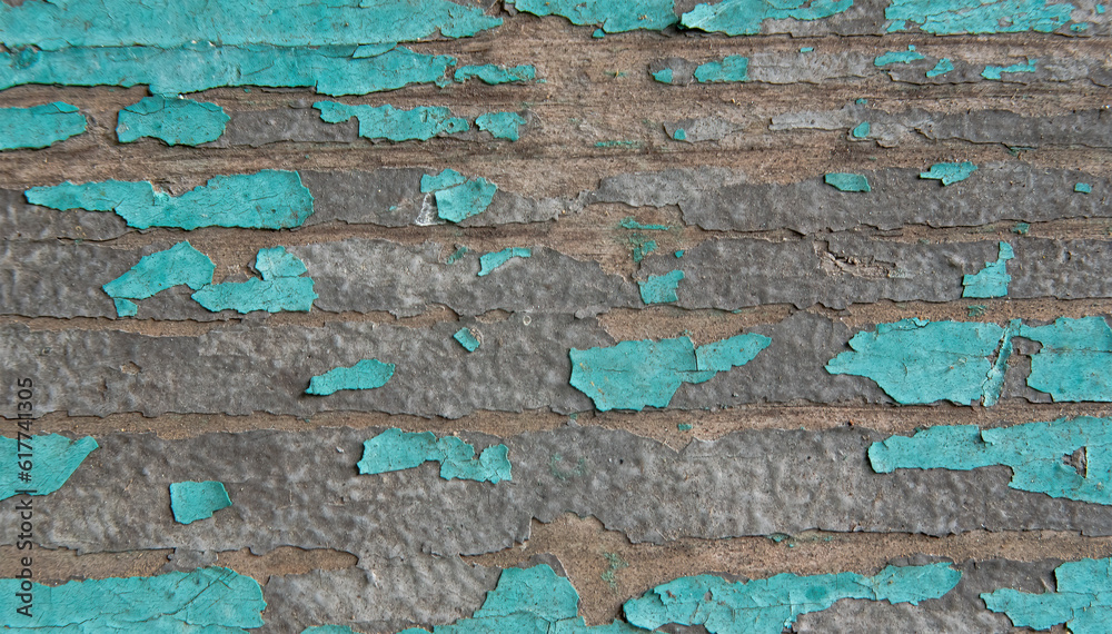 A pattern of peeling turquoise paint. On a wooden, fleecy surface. Retro style A pattern of peeling turquoise paint. On a wooden, fleecy surface. Retro style
