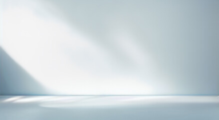 Minimal abstract light blue background for product presentation. Shadow and light from windows on plaster wall.