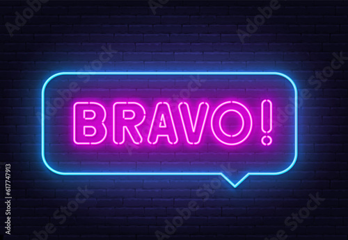 Bravo neon sign in the speech bubble on brick wall background.