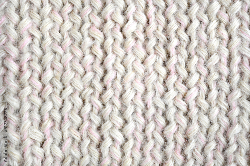 Grey, pink, white color wool knitted background close up Grey, pink, white color wool knitted background close up