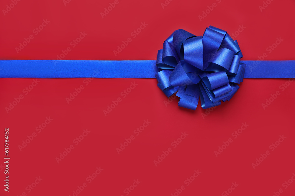 Blue ribbon with bow on red background, top view. Space for text Blue ribbon with bow on red background, top view. Space for text