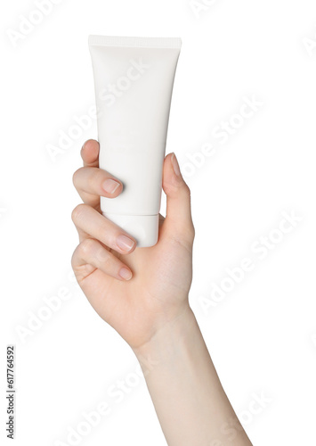 Woman holding tube of face cleansing product on white background, closeup