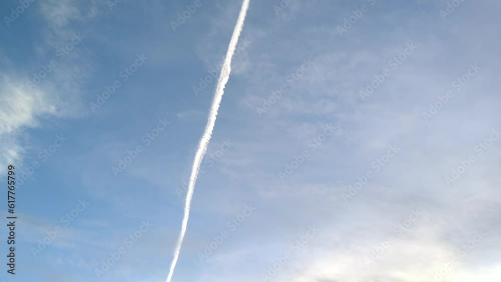 Birds flying at sunset with the clouds blurred in the sky. Cloud that looks like a road Birds flying at sunset with the clouds blurred in the sky. Cloud that looks like a road