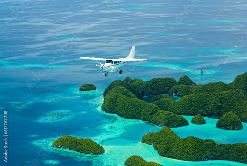 Aerial shot of Light aircraft flying over tropical islands in Micronesia