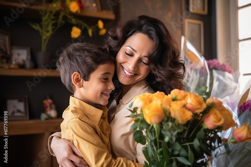 Young ethnic woman mother with flower bouquet embracing son while getting congratulations on Mother's day. Generative AI