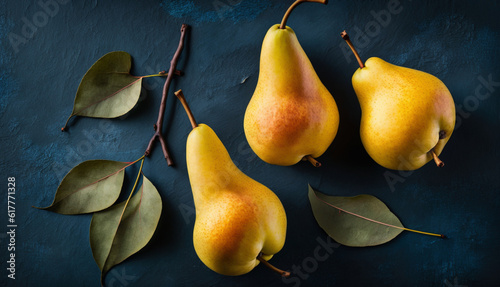 pears on a wooden background, close up photo of some yellow pears 