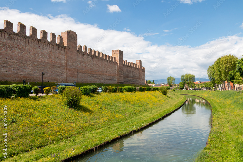 View of the medieval walls and moat of the city of Cittadella.