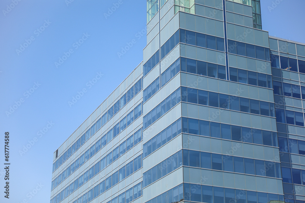 modern building in the heart of the financial district, symbolizing progress and prosperity in the commercial real estate industry. Its large windows represent transparency and sleek design modern building in the heart of the financial district, symbolizing progress and prosperity in the commercial real estate industry. Its large windows represent transparency and sleek design