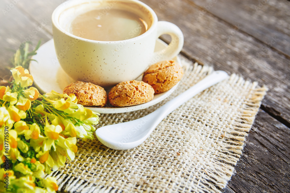 cup of coffee with macaroons and a bouquet of flowers. motivational beautiful breakfast background
cup of coffee with macaroons and a bouquet of flowers. motivational beautiful breakfast background