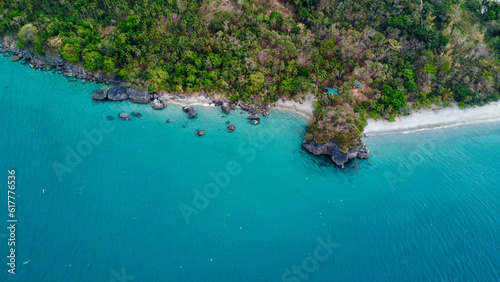 View of island. Beach and sea. Aerial view of the coast of a tropical island and a sandy beach among the jungle.