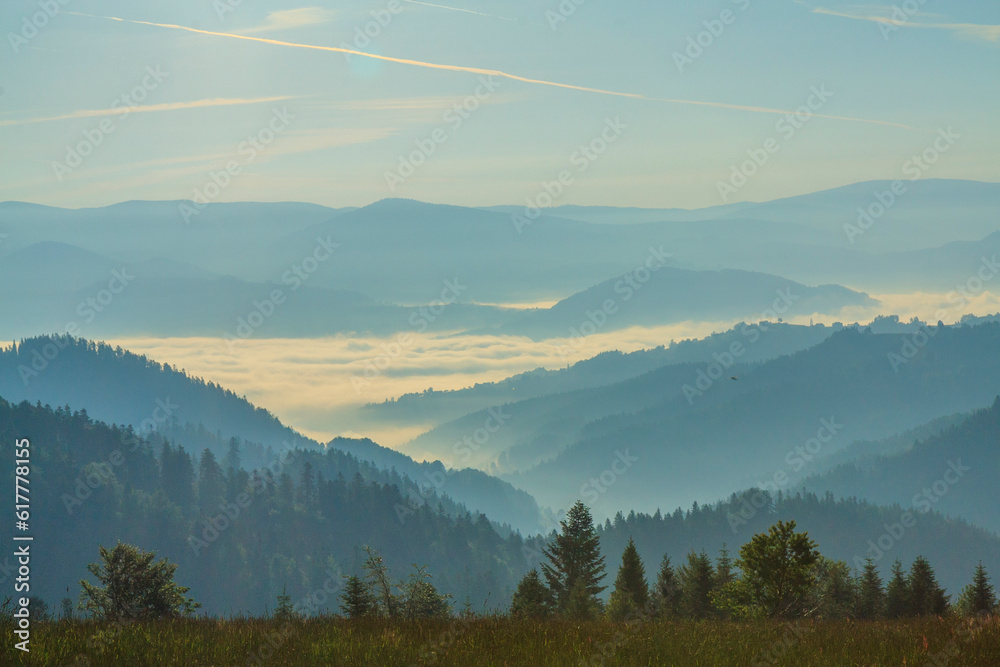 Morning view of the peaks of Beskid Sądecki (Poland) from the tourist trail near Obidza on a spring