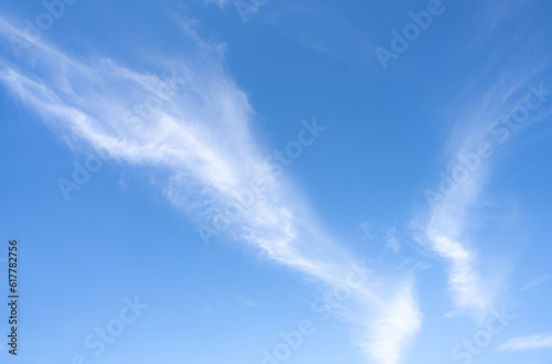 Blue sky and white cirrocumulus clouds texture background. Blue sky on sunny day. Summer sky. Cloud formation. Fluffy clouds. Nice weather in summer season. Weather pattern. Atmospheric phenomenon.