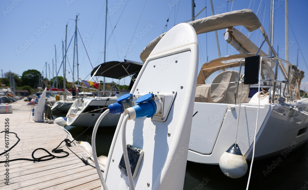 Electrical power outlet on a ship harbour bay. Photo with the electricity outlets used for parked ships and yachts at the sea side marina.