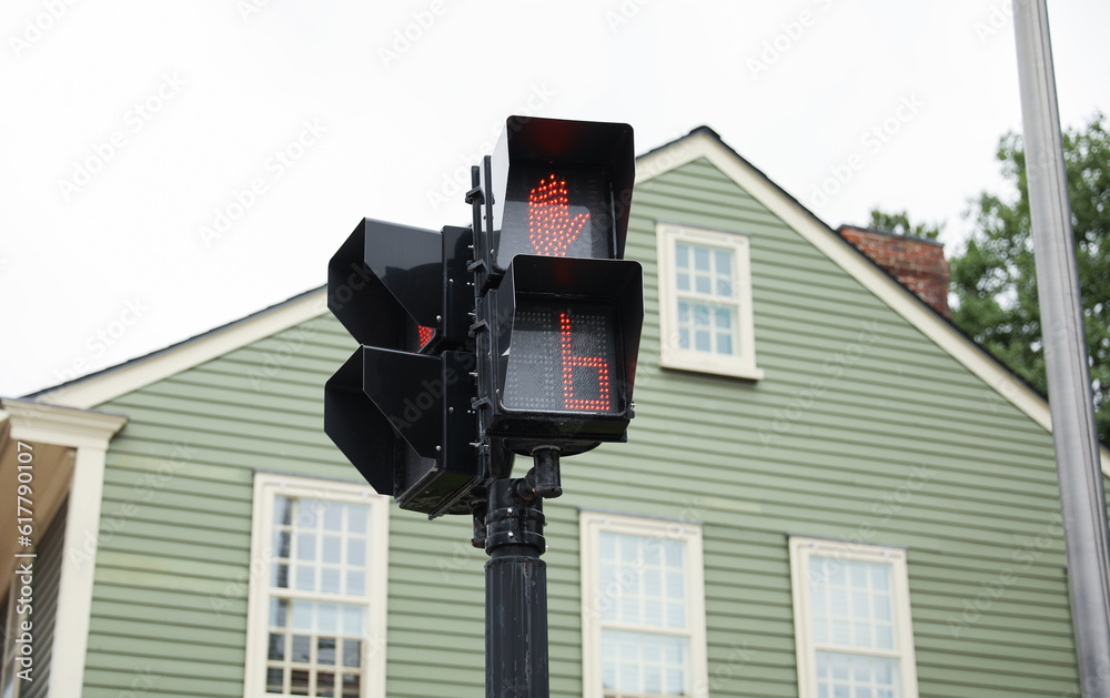 street light with traffic signals, displaying the colors red, green, and yellow. The walking