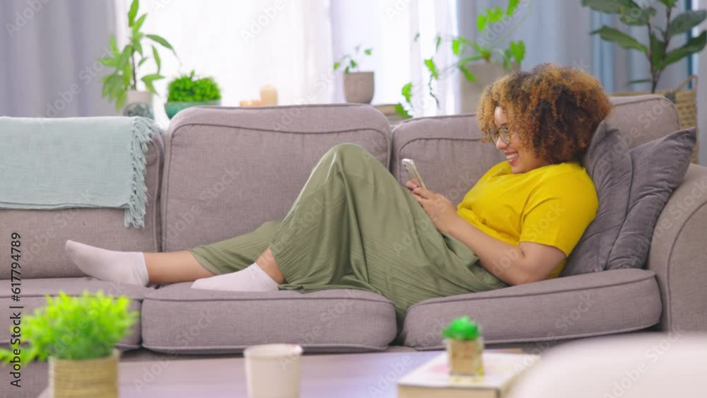 Relax, texting and woman with phone on a sofa for social media, reading and chatting in her home. Smartphone, app and female person in a living room chilling on day off and online dating website Relax, texting and woman with phone on a sofa for social media, reading and chatting in her home. Smartphone, app and female person in a living room chilling on day off and online dating website