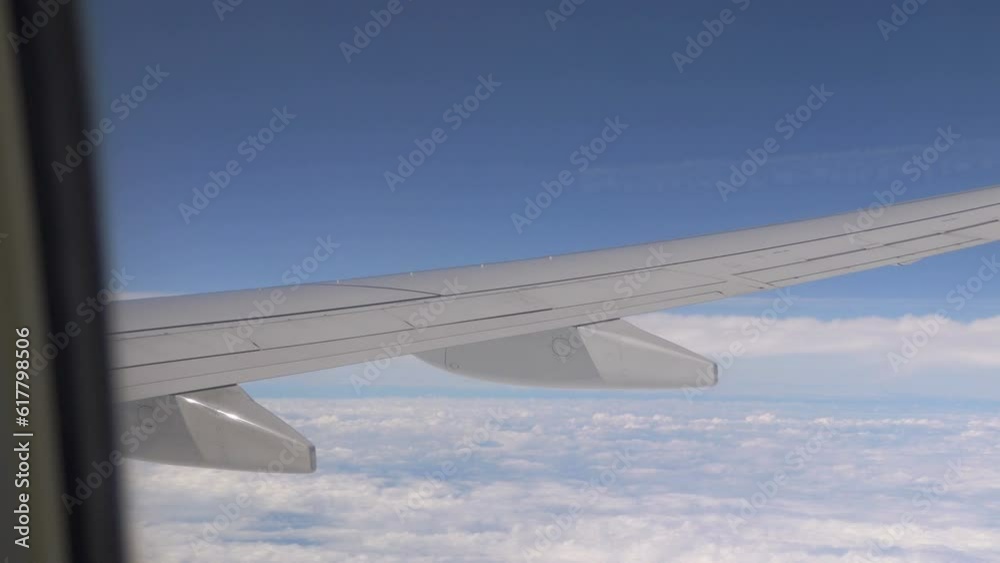 Airplane flight above the clouds in 4K slow motion 60fps Airplane flight above the clouds in 4K slow motion 60fps