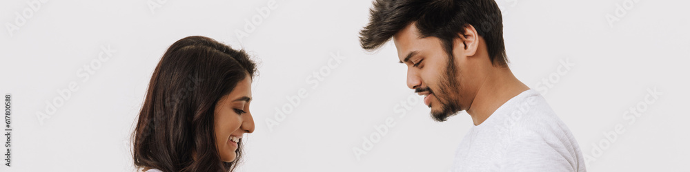 Young indian man giving present box to his girlfriend Young indian man giving present box to his girlfriend