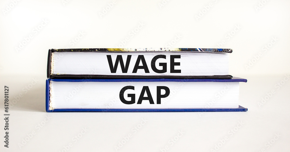 Wage gap symbol. Concept words Wage gap on beautiful books on a beautiful white table white background. Business, support and wage gap concept. Copy space.