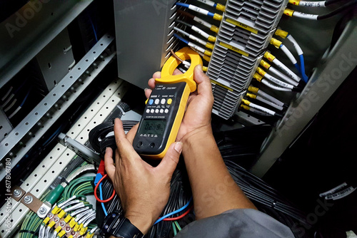 The commissioning engineer used a current clamp meter measuring current at the terminal of the current transformer secondary side