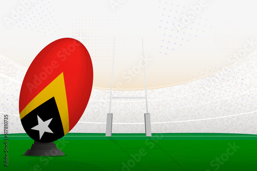 East Timor national team rugby ball on rugby stadium and goal posts, preparing for a penalty or free kick.
