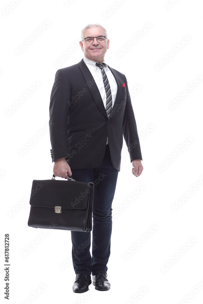 in full growth. a senior business man with a leather briefcase. in full growth. a senior business man with a leather briefcase.