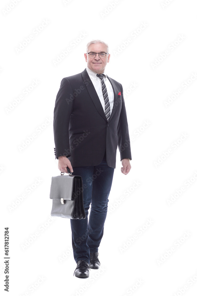 in full growth. a senior business man with a leather briefcase. in full growth. a senior business man with a leather briefcase.