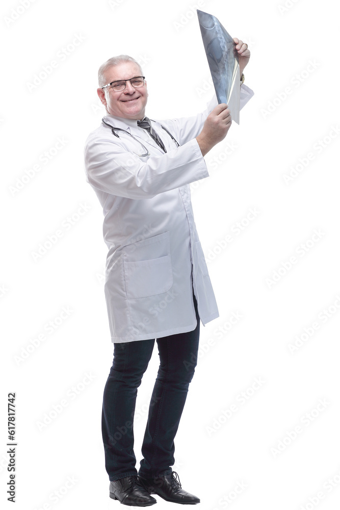 in full growth. smiling male therapist with an x -ray . in full growth. smiling male therapist with an x -ray .
