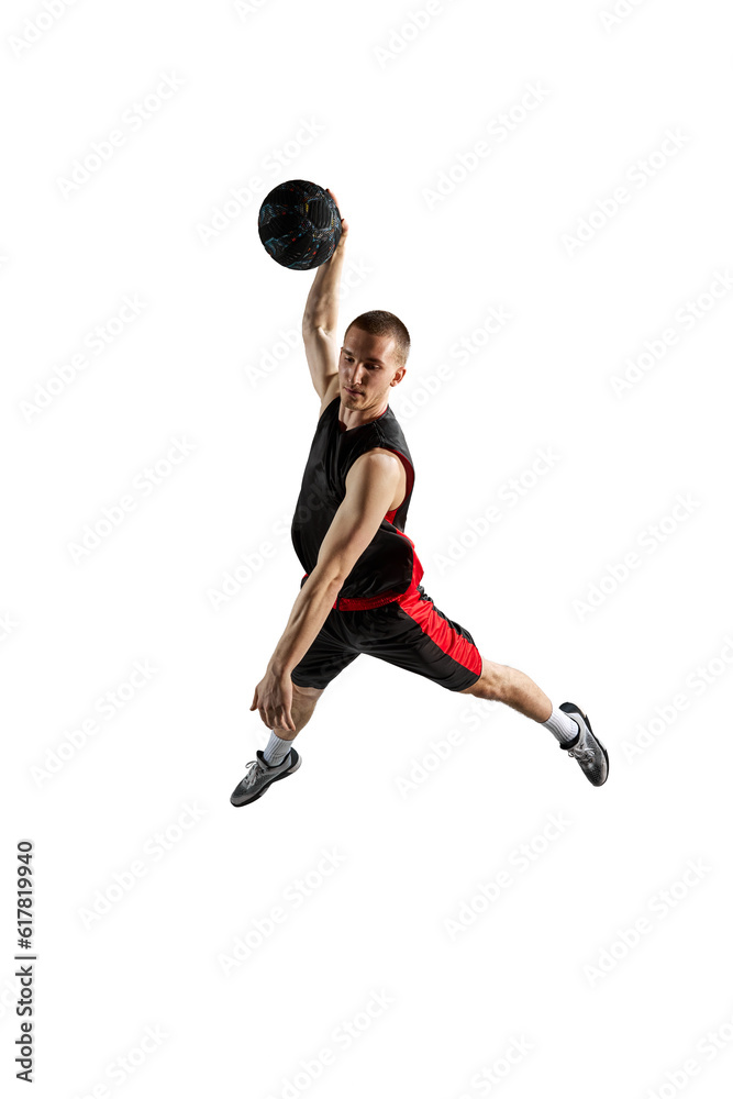 Slam dunk. Full-length dynamic image of young man, basketball player in jump with ball isolated against white background. Concept of sport, action and motion, health, game, hobby, sportswear, ad