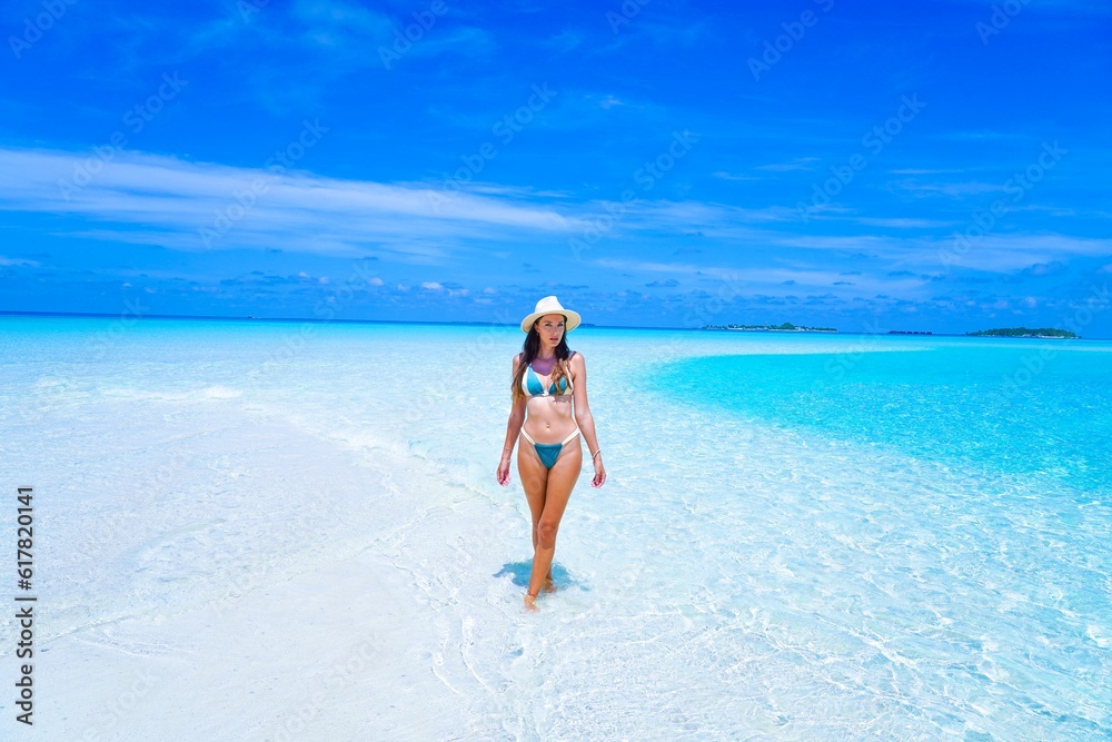 woman on the sandbank in maldives, maldives beach shooting woman on the sandbank in maldives, maldives beach shooting