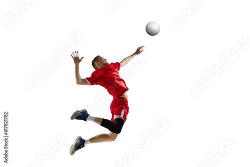 Dynamic image of young sportive man, professional volleyball player in red uniform in motion, hitting ball on white studio background. Concept of sport, active lifestyle, health, dynamics, game, ad © master1305