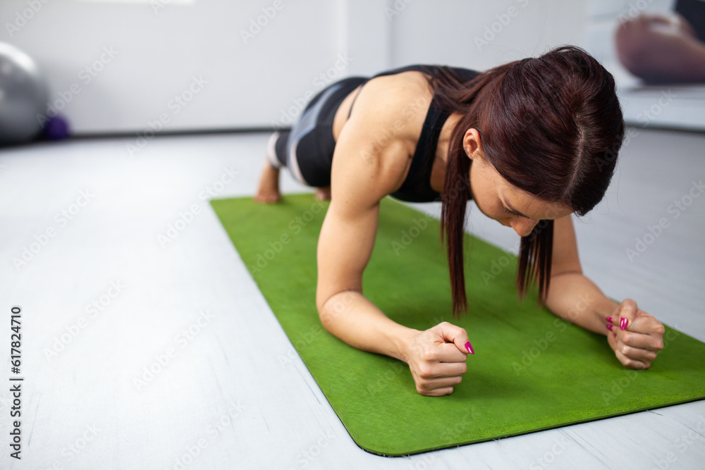 Pilates, fitness, sport, training and people concept. Beautiful young woman doing exercises Pilates, fitness, sport, training and people concept. Beautiful young woman doing exercises