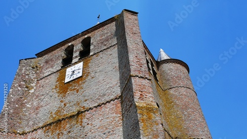 Eglise catholique fortifiée Saint Corneille et Saint Cyprien avec tour de défense  dans le village d'Hary dans l'Aisne en Thiérache région des Hauts de France en France Europe photo