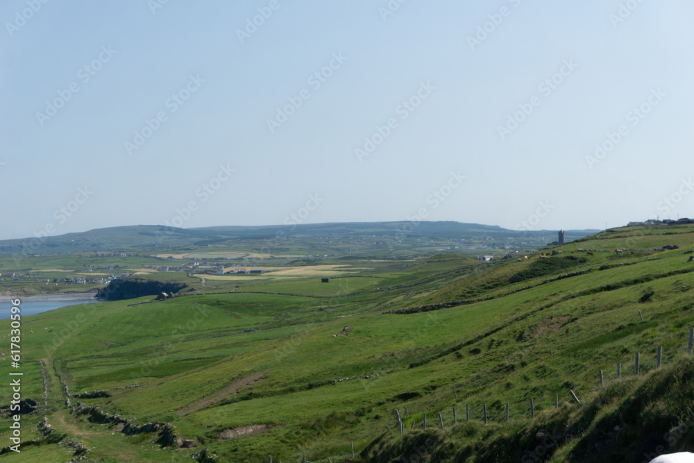 Panoramic view of Cliffs of Moher on a sunny day in Burren, Ireland