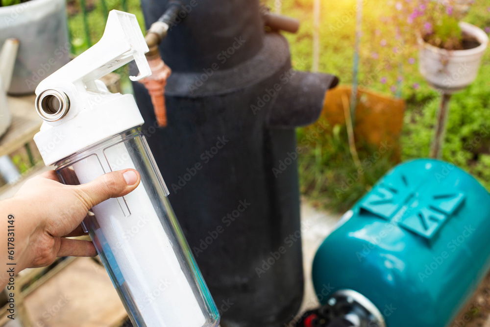 Filtration of water from a well with a sand and dirt filter. Water supply in the country. Filtration of water from a well with a sand and dirt filter. Water supply in the country.
