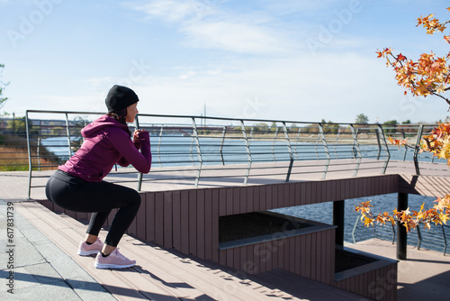 Fototapeta Naklejka Na Ścianę i Meble -  Fitness woman training outdoor in urban environment
