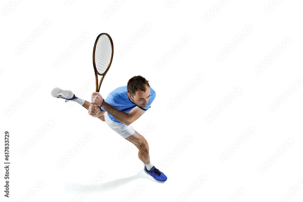 Top vie image of man in motion, playing tennis, running with racket, hitting ball isolated over white background. Concept of sport, active lifestyle, game, hobby, health, dynamics, ad