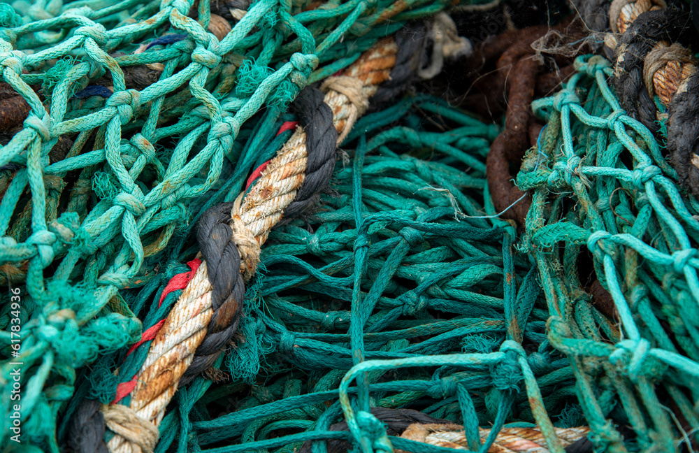 Pile of fishing rope and nylon netting. Close up view