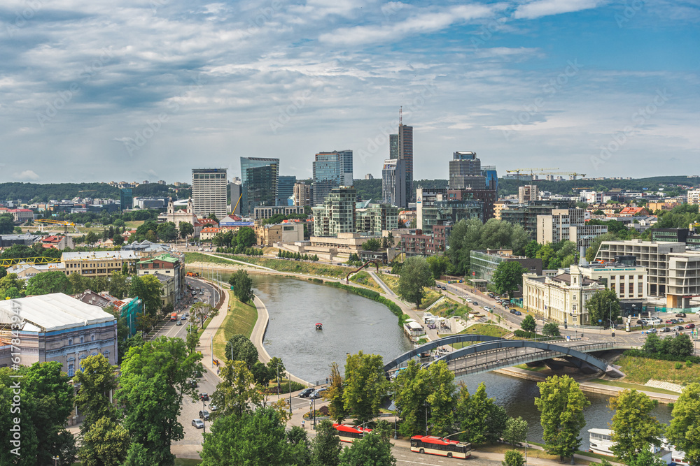 Vilnius, capital of Lithuania, Europe. Aerial view of the city, modern business financial district, architecture, buildings, with river and bridge, NATO summit 2023