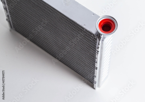 New car radiator car stove on a white background, close-up photo