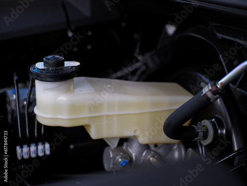 Close-up of a car's brake fluid reservoir tank