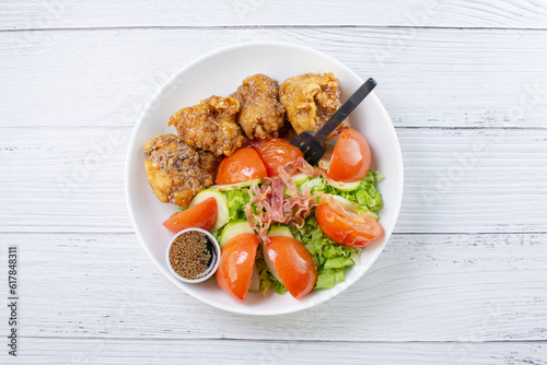 Obraz na płótnie protein bowl and salad, accompanied by pieces of chicken in sweet and sour sauce, tomatoes in lemon, lettuce, apple, pieces of bacon in teriyaki sauce w salonie
