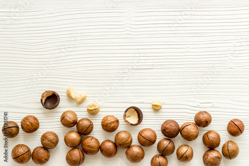 Flat lay of macadamia nuts, top view. Healthy protein food background
