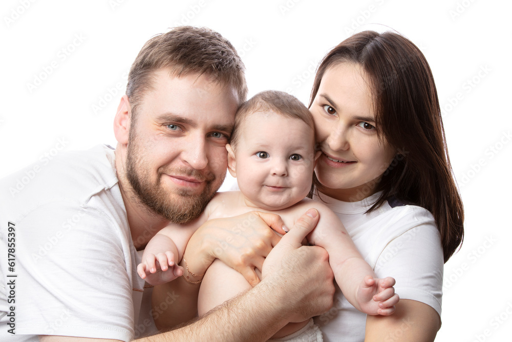 Close up portrait of young parents and baby. Father and mother kiss and hug a beautiful little son. The concept of love, happy fatherhood and motherhood. Close up portrait of young parents and baby. Father and mother kiss and hug a beautiful little son. The concept of love, happy fatherhood and motherhood.