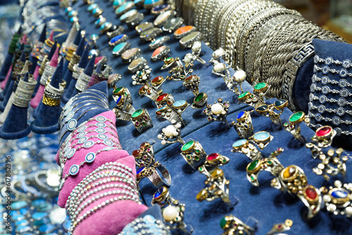 Showcase for sales of jewelry and bijouterie on Istanbul grand bazaar marketplace. Rings, earrings, bracelets and other - traditional gifts for friends and relatives from travels by Turkey