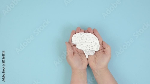 Holding a brain in the hands, Parkinson disease, Alzheimer awardness, mental disorder dementia, psychology problems, adhd, cerebral vein thrombosis photo