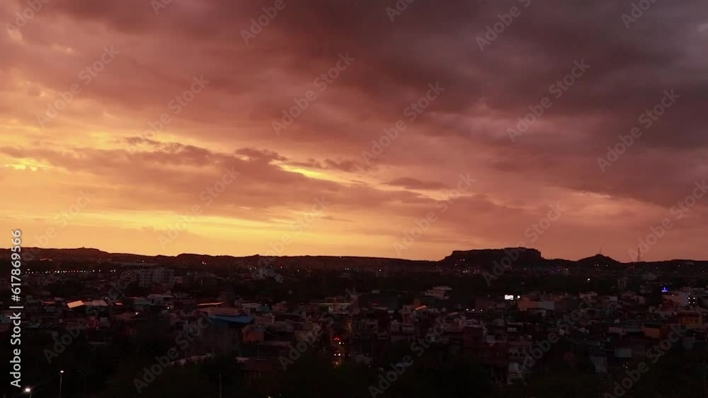 dramatic sunset orange sky with city backlit view from mountain top at evening timelapse dramatic sunset orange sky with city backlit view from mountain top at evening timelapse