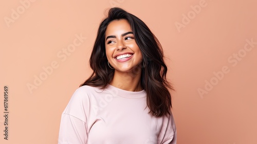 Smiling happy attractive hispanic young woman posing in studio shot