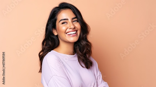 Photographie Smiling happy attractive hispanic young woman posing in studio shot